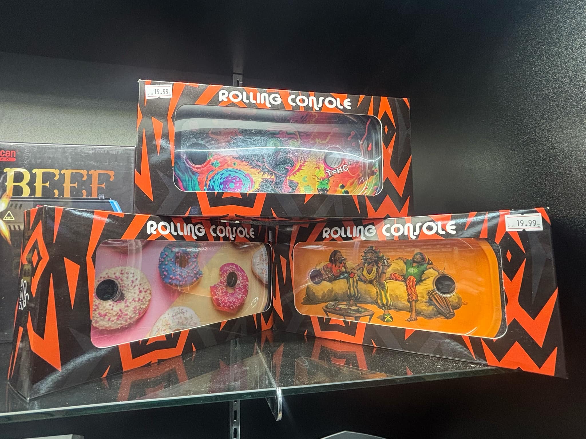 A couple of boxes of doughnuts sitting on a shelf